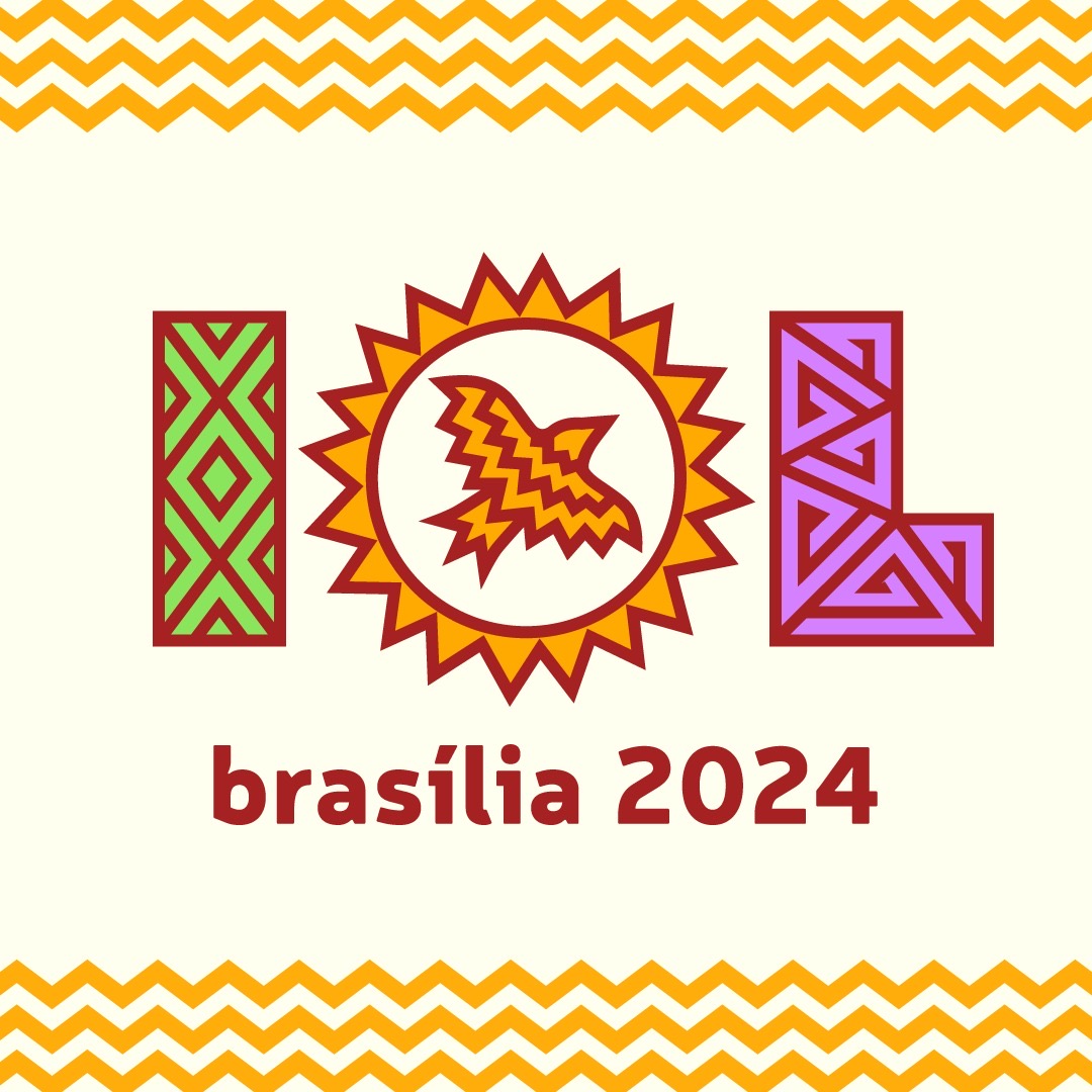 Logo for the International Linguistics Olympiad 2024 in Brasília. The design features the letters 'IOL' in a stylized, colorful font. The 'I' is green with a diamond pattern, the 'O' is a sunburst shape with a bird inside, and the 'L' is purple with a geometric pattern. The text 'brasília 2024' is written in red below the letters. The top and bottom of the image are bordered with yellow zigzag lines.